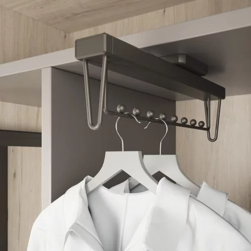 Detail of the extractable hangers for the interior of the walk-in wardrobe