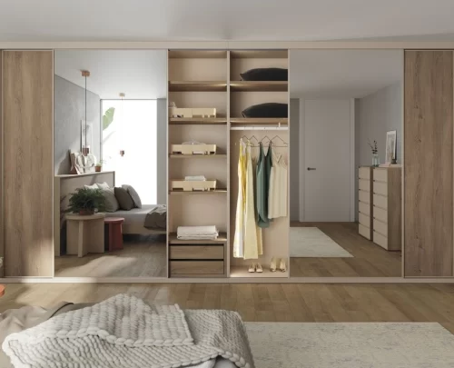 Detail of the mirrored sliding doors in this large wardrobe