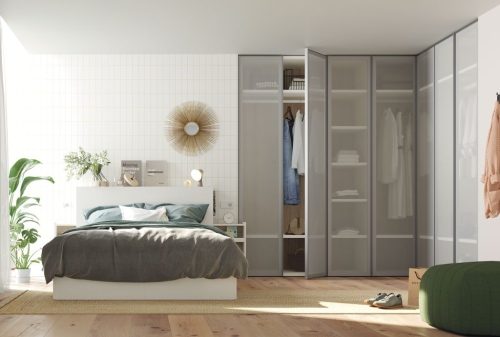 Bedroom with corner wardrobe with glass doors