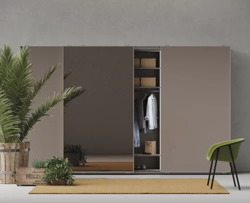 Built-in wardrobe with three sliding doors and glass center