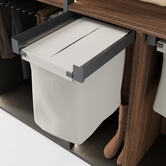 Detail of the pull-out laundry basket for wardrobe interiors