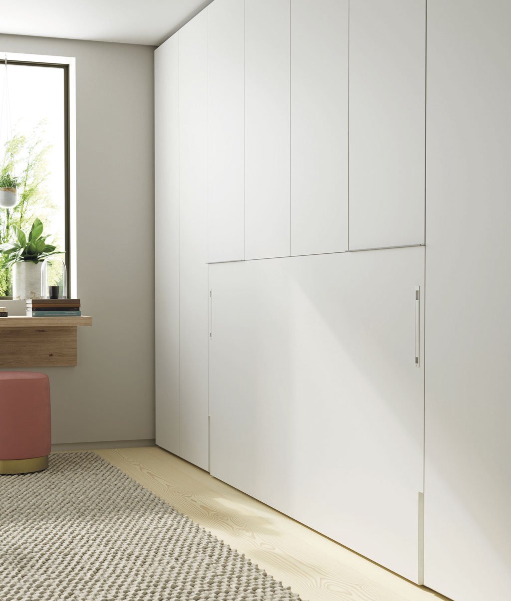 Fold-down bed integrated with side and top wardrobes