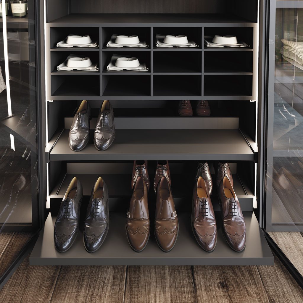 Detail of the cubby and pull-out shoe rack as interior accessories of the wardrobe Detail of the cubby and pull-out shoe rack as interior accessories of the wardrobe
