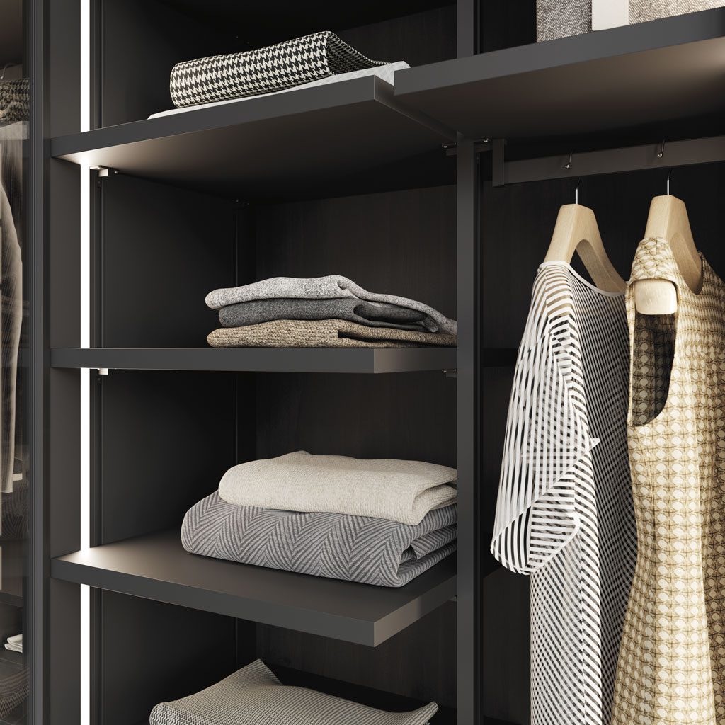 Detail of the shelves with the Rail System in the walk-in wardrobe with LED light Detail of the shelves with the Rail System in the walk-in wardrobe with LED light