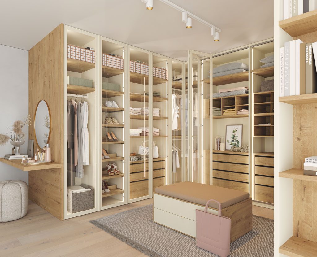 Detail of the walk-in closet with glass doors and a bench with drawers in the center Detail of the walk-in closet with glass doors and a bench with drawers in the center